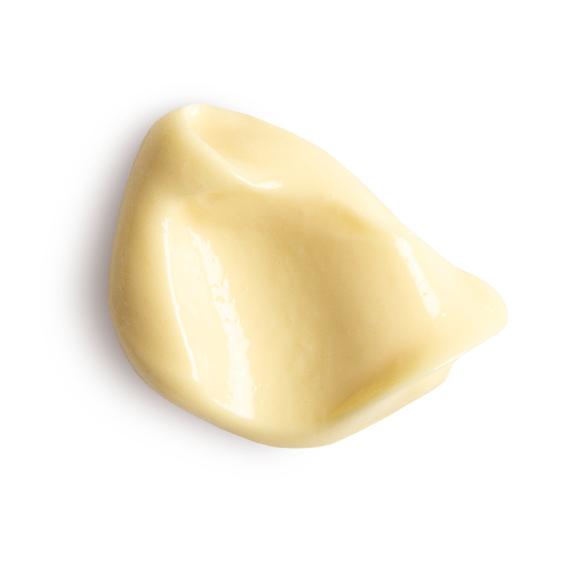 Beige cosmetic cream swatch on a white background