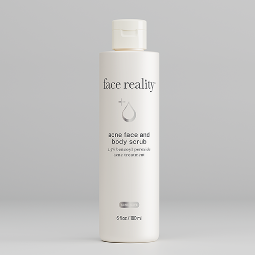 White bottle of 'face reality' acne face and body scrub on a gray background