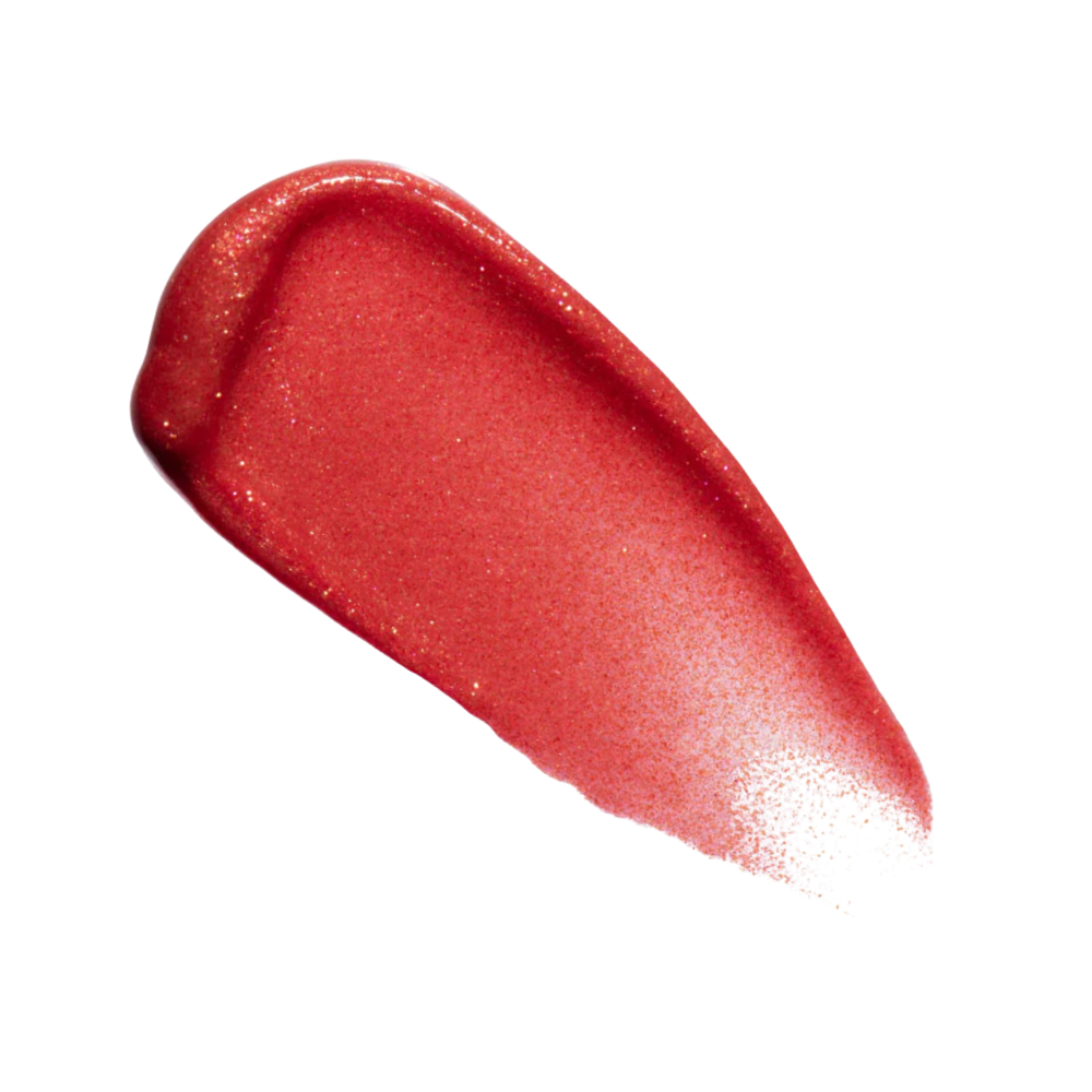 A sparkly warm red lip gloss on white background.