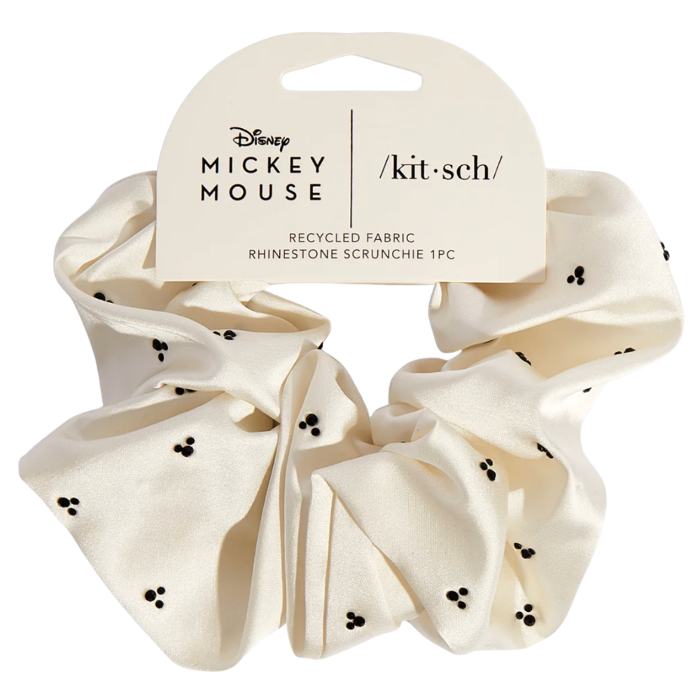 Beige scrunchie with black polka dots and Disney Mickey Mouse packaging on a white background