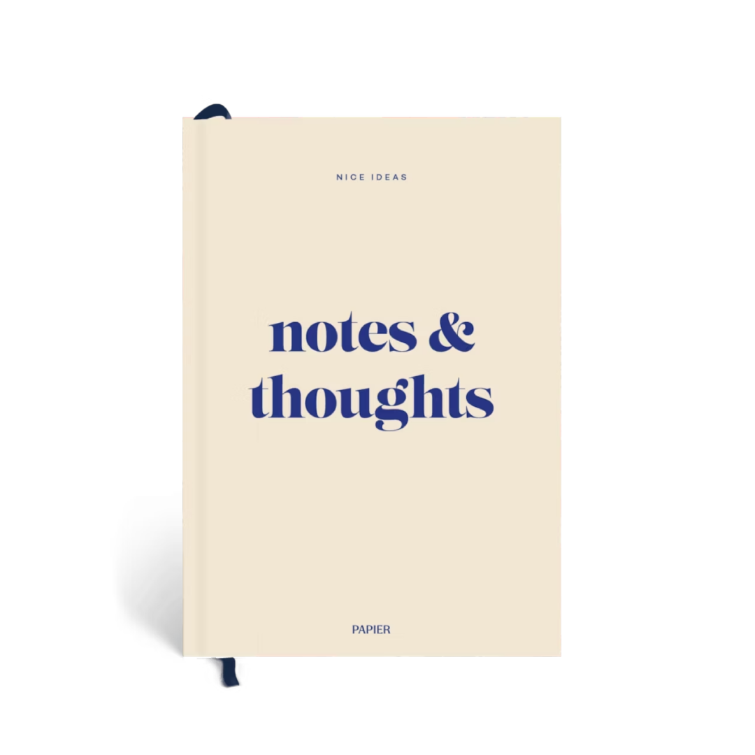 Beige notebook with 'notes & thoughts' text on a white background