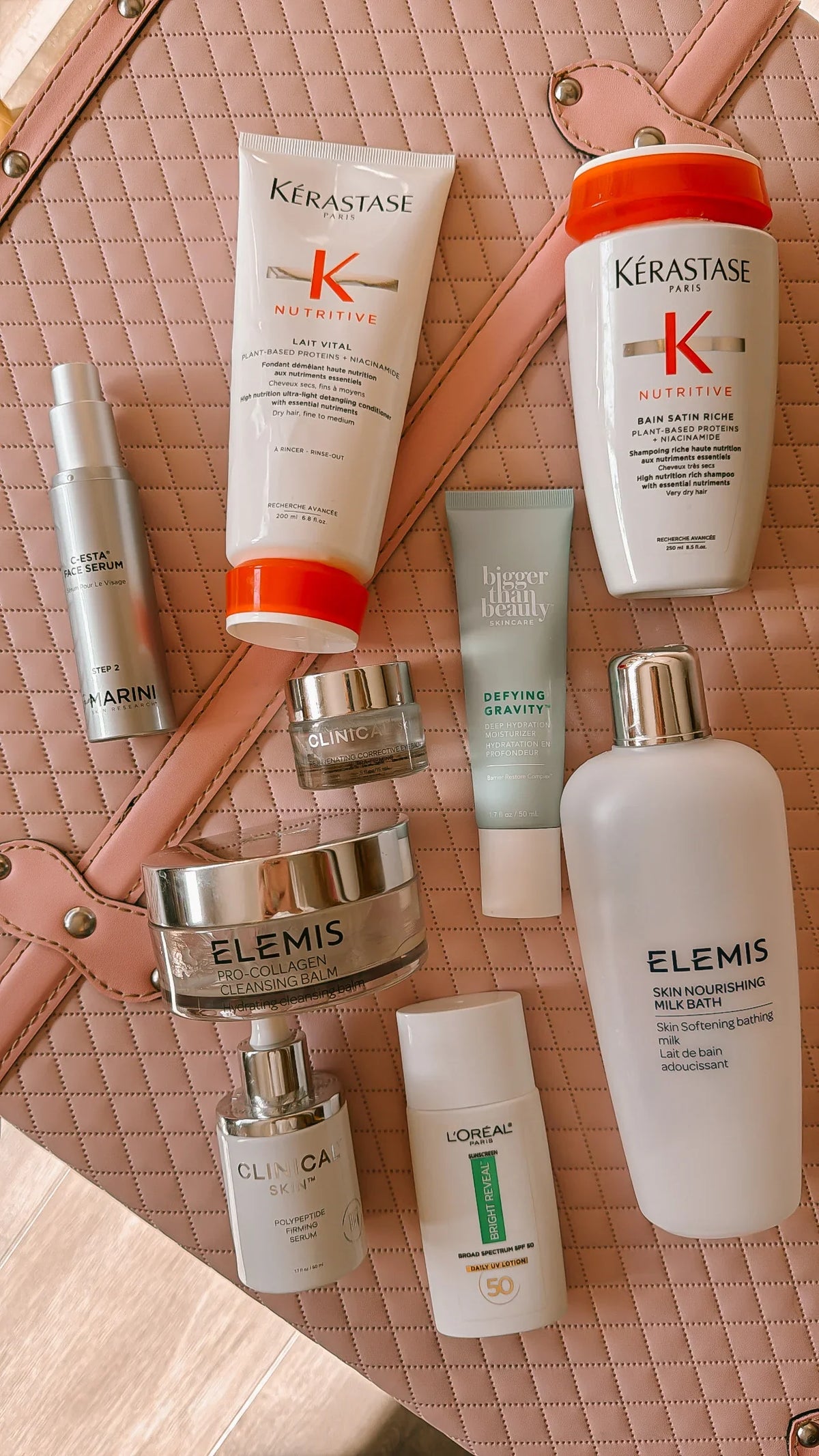 a collage of skincare products emptied on a pin background.  ft kerastase, jan marini, elemis and clinical skin