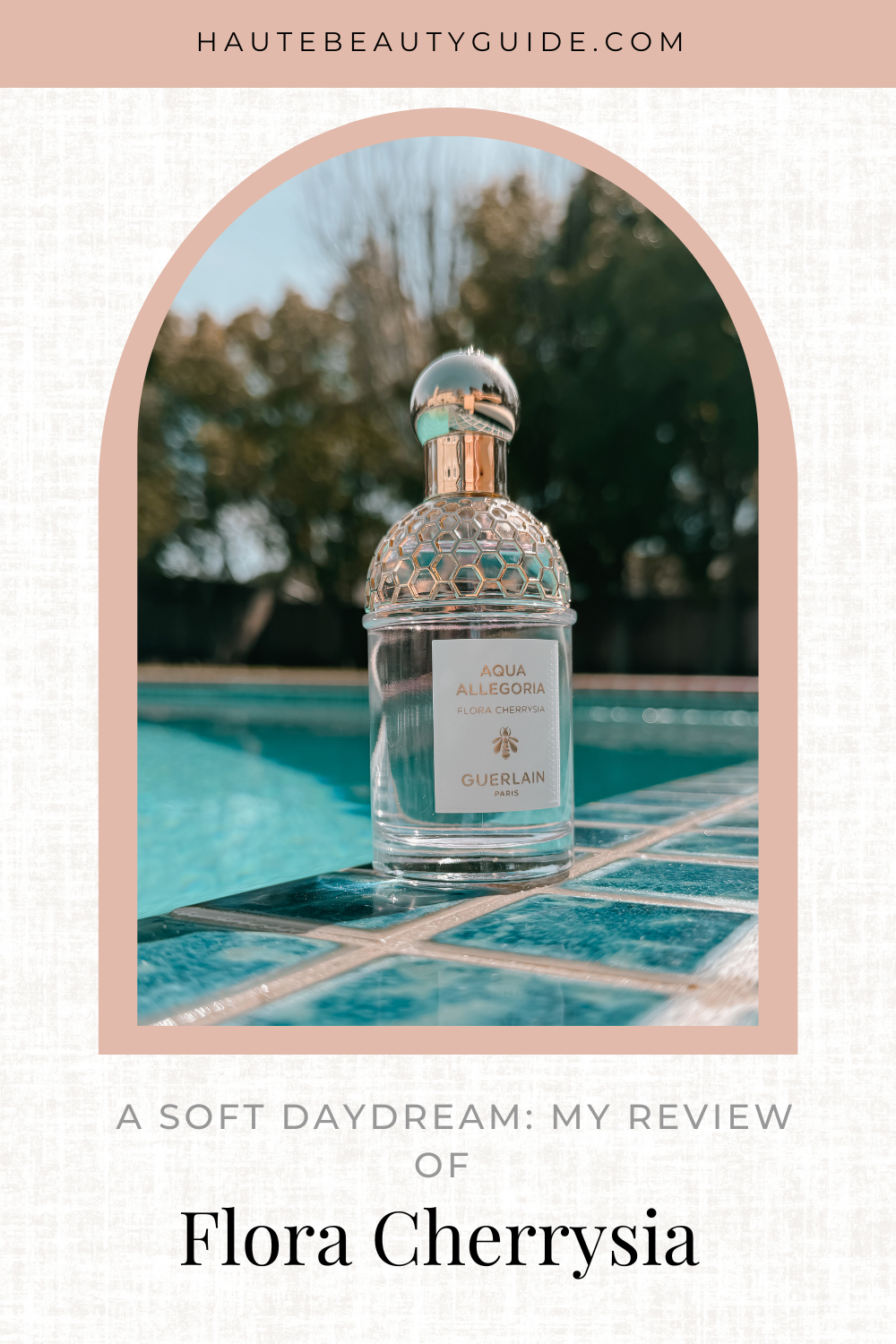Guerlain Flora Cherrysia perfume bottle on a teal pool deck