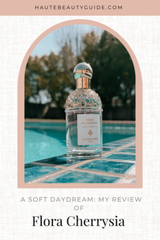 Guerlain Flora Cherrysia perfume bottle on a teal pool deck