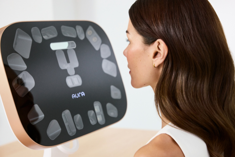 Woman looking at a Aura REality with 'Aura' branding on a white background