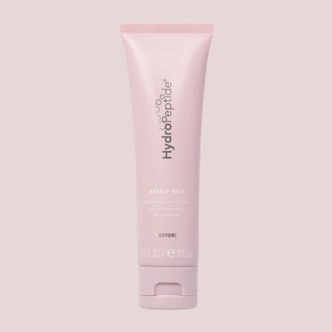 Pink tube of HydroPeptide skincare product on a light blush background