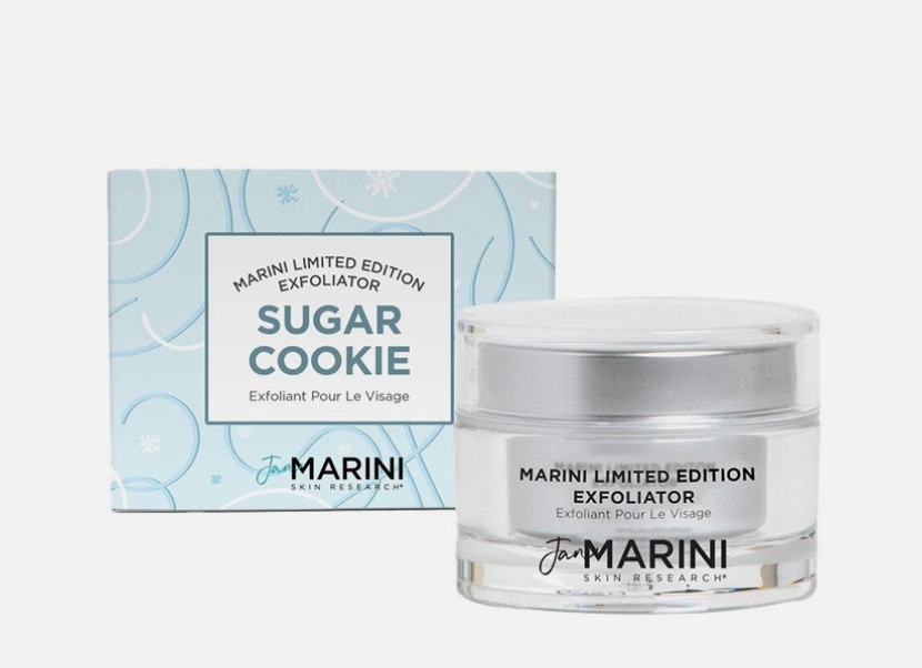 Jan Marini Sugar Cookie Exfoliator jar in front of its light blue patterned packaging box, on a clean white background.