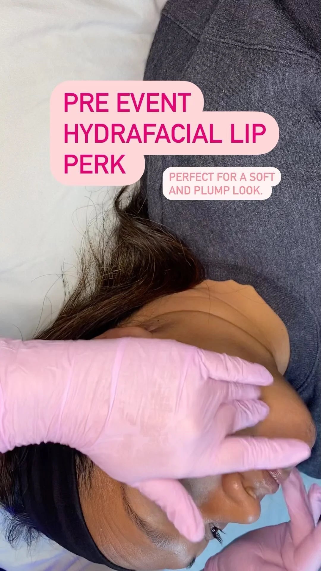 A close-up of a person lying down while another person in pink gloves applies a cosmetic treatment to the face. Pink text overlays read 'PRE EVENT HYDRAFACIAL LIP PERK' and 'PERFECT FOR A SOFT AND PLUMP LOOK.
